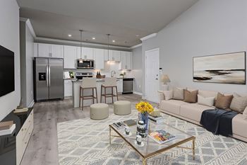 Living room with kitchen view at The Reserve at Mayfaire Apartments, Wilmington NC